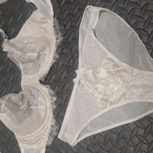 VS tanish sheer with shimmer gold lace bra and matching panties.   Never worn.